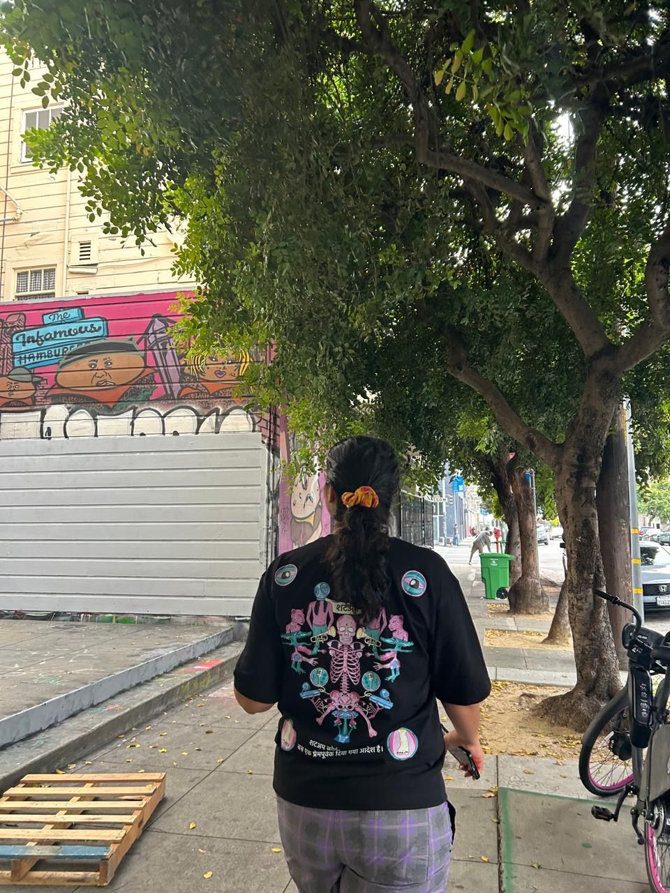 Rebel in the SHUTUP tee on a graffiti street